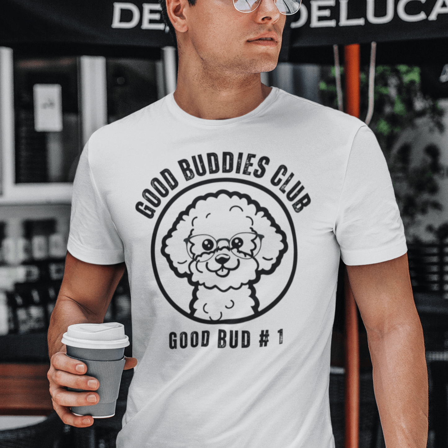 "Good Buddies Club unisex black T-shirt featuring a cheerful, happy Bichon Frise dog illustration wearing glasses, perfect for dog owners and dog lovers. Fun and unique dog-themed shirt design, ideal not only for Bichon Frise fans but all dog enthusiasts."
