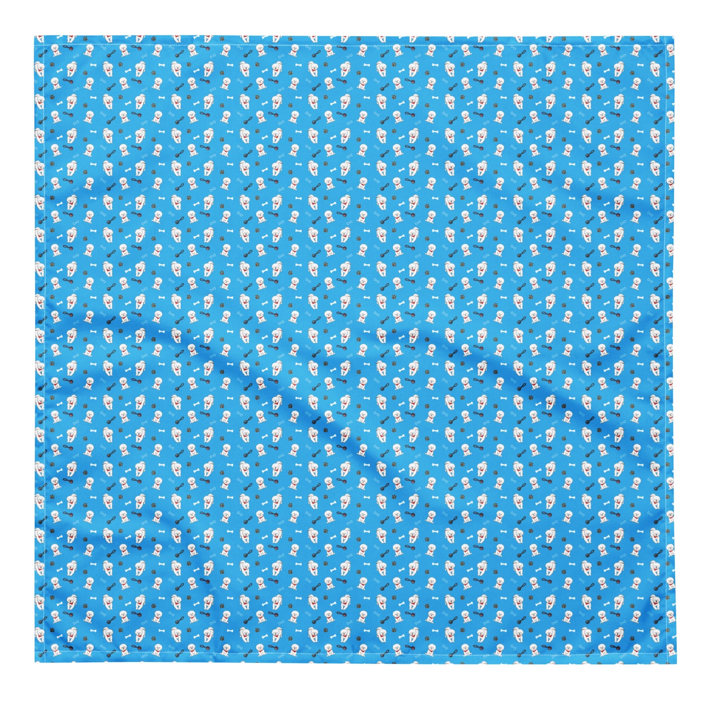 Close-up of blue Bichon Frise patterned bandana fabric with playful dog, paw, and bone designs