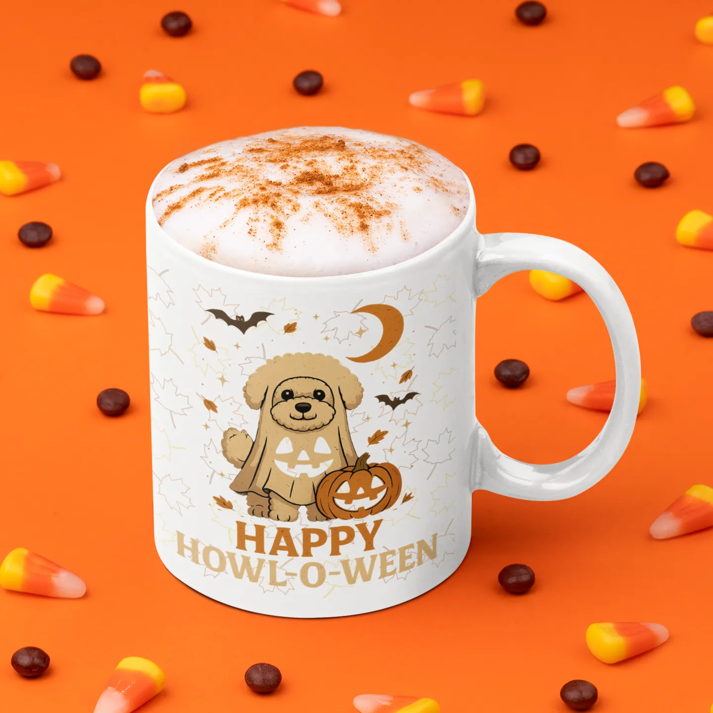 White ceramic coffee mug with "Happy Howl-o-ween" Bichon Frise Halloween design, surrounded by candy corn on an orange background
