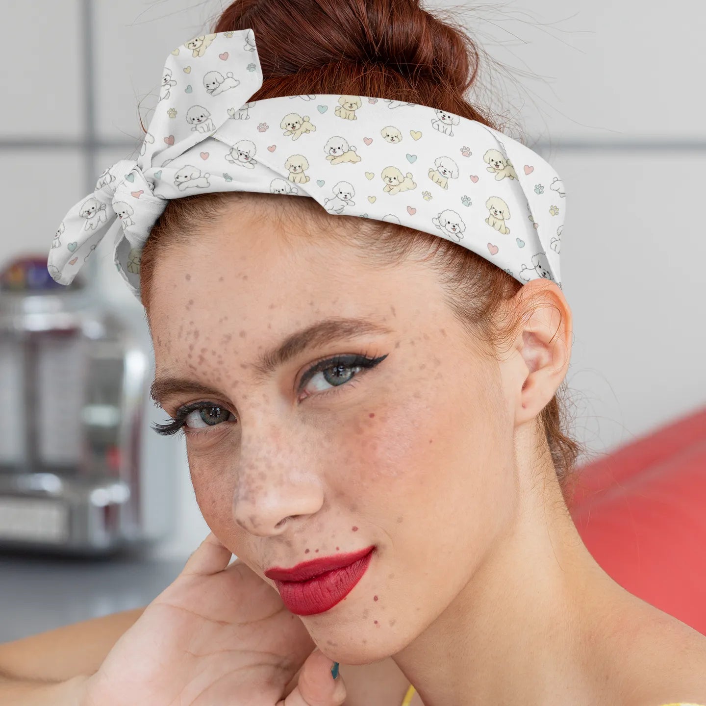 Close-up of a young woman wearing a headband-style bandana with a cute Bichon Frise dog pattern, pastel hearts and paw prints – stylish accessory mockup