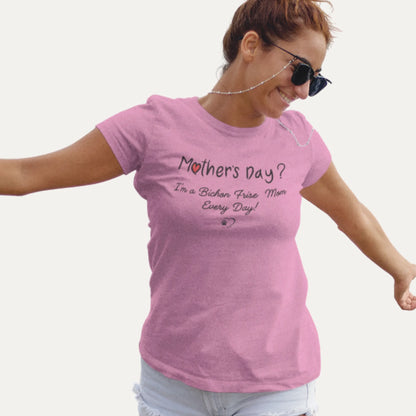 Woman wearing a pink t-shirt with a humorous message on a white background