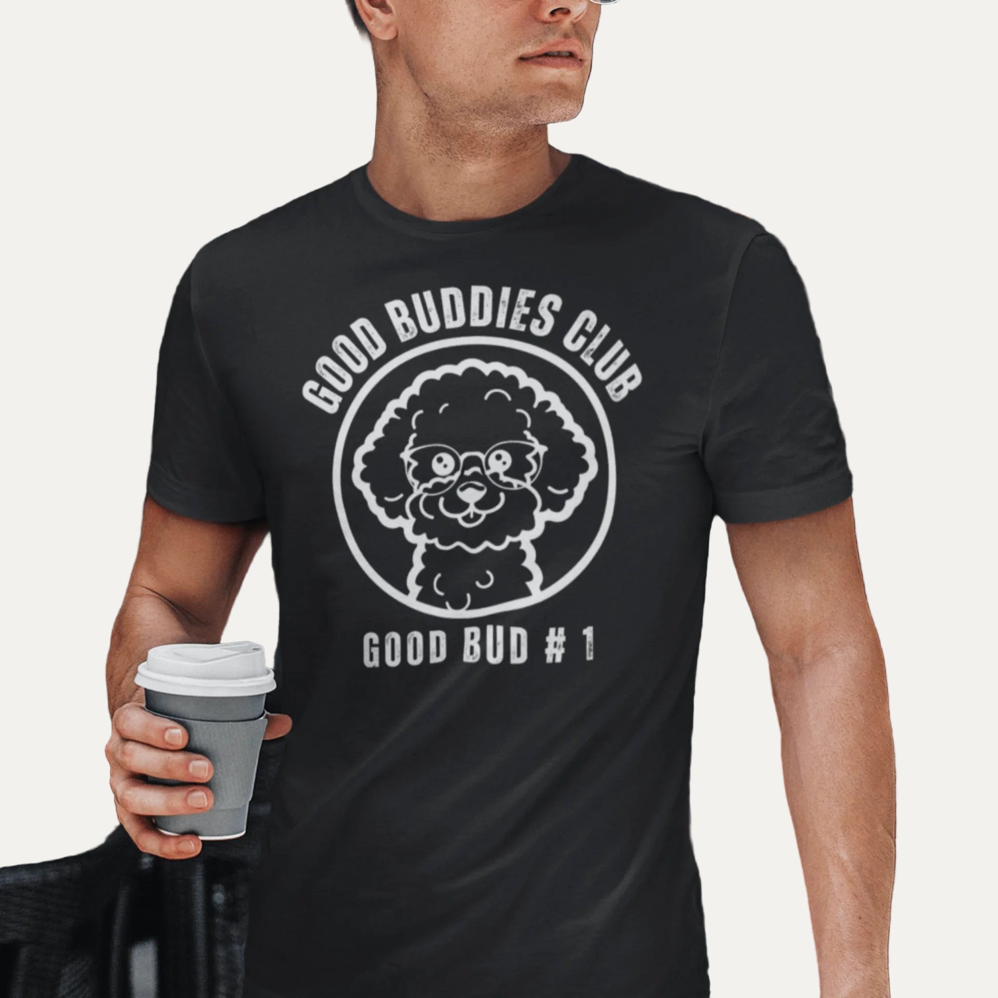 “Good Buddies Club unisex T-shirt featuring a cheerful, smiling Bichon Frise dog wearing glasses illustration with white design. Fun and happy dog-themed shirt for men and women, perfect for dog owners and dog lovers beyond just Bichon Frise fans.”