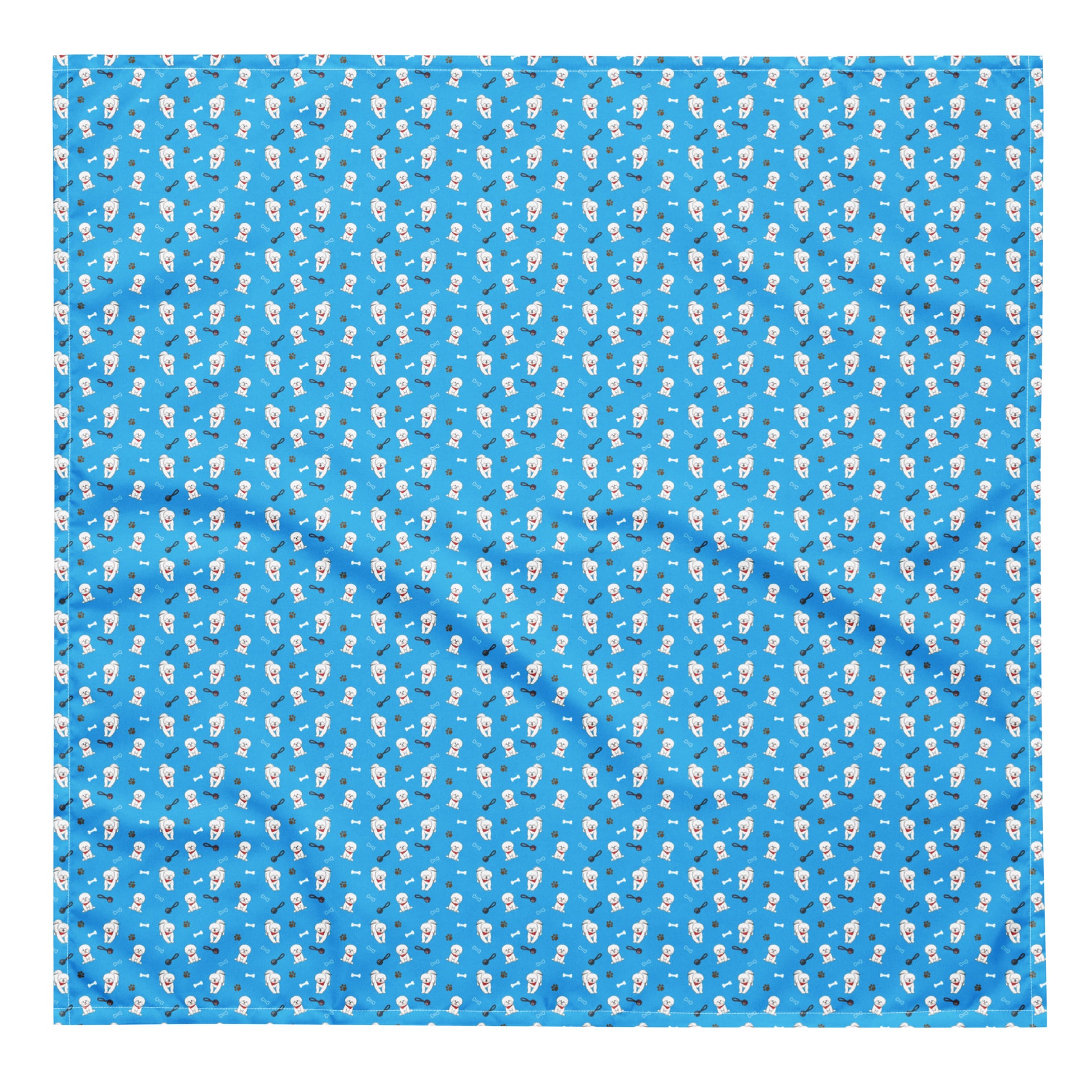Close-up of blue Bichon Frise patterned bandana fabric with playful dog, paw, and bone designs