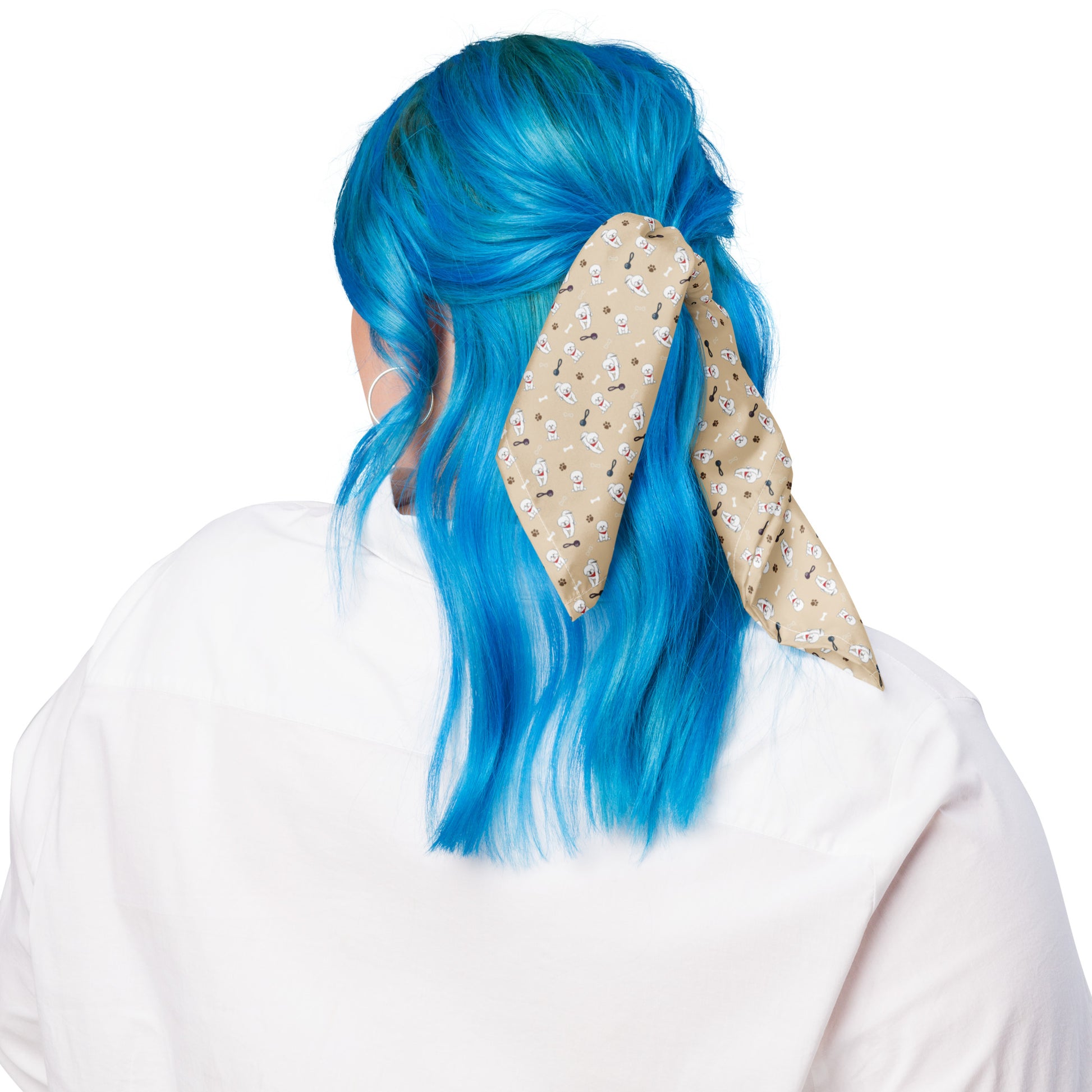 Woman with blue hair wearing beige Bichon Frise patterned bandana as hair accessory