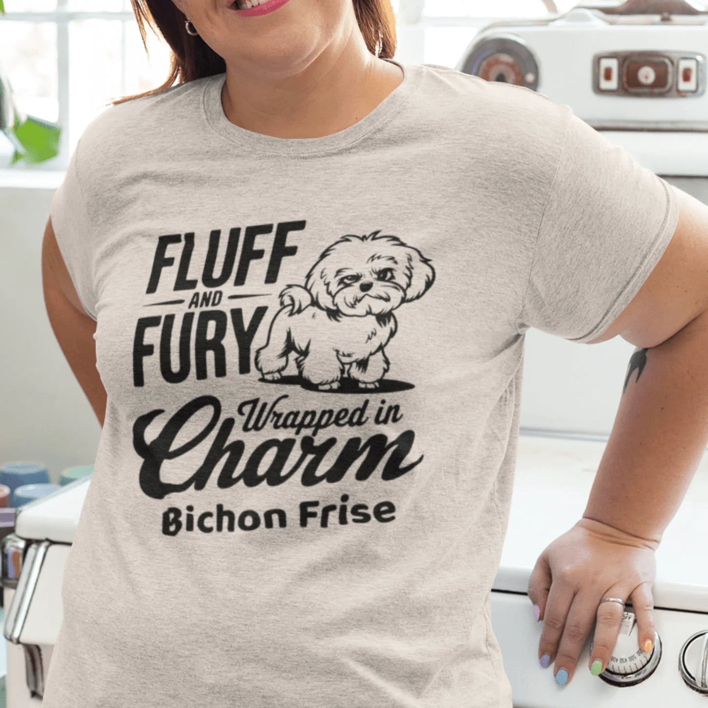 "Unisex black T-shirt with sarcastic black text 'Fluff And Fury Wrapped In Charm' featuring a cute Bichon Frise dog illustration, perfect for Bichon Frise dog lovers and owners."