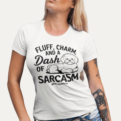 "Unisex Bichon Frise T-shirt with black text design 'Fluff, Charm and a Dash of Sarcasm' featuring a cute custom dog illustration – perfect gift for Bichon lovers and dog owners."