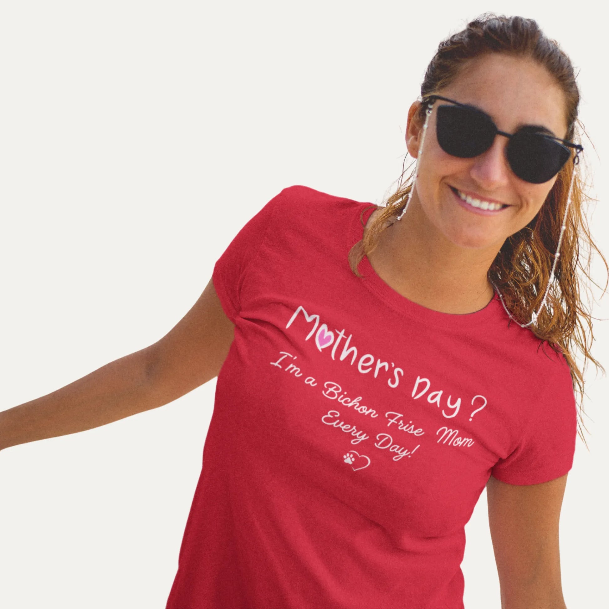 Woman wearing a red 'Mother's Day I'm a Bichon Frise Mom Every Day' t-shirt on a white background