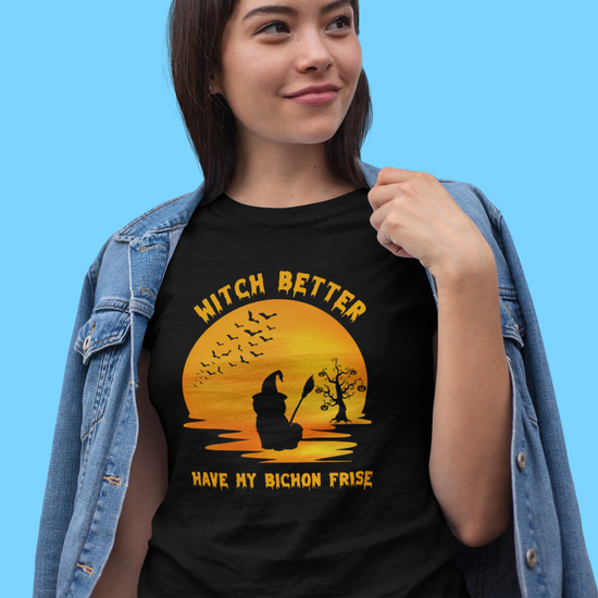 Halloween-themed video of a woman dressed as a witch holding a black cat and wearing a funny “Witch Better Have My Bichon Frise” t-shirt – spooky and playful scene for dog lovers and Halloween fans.