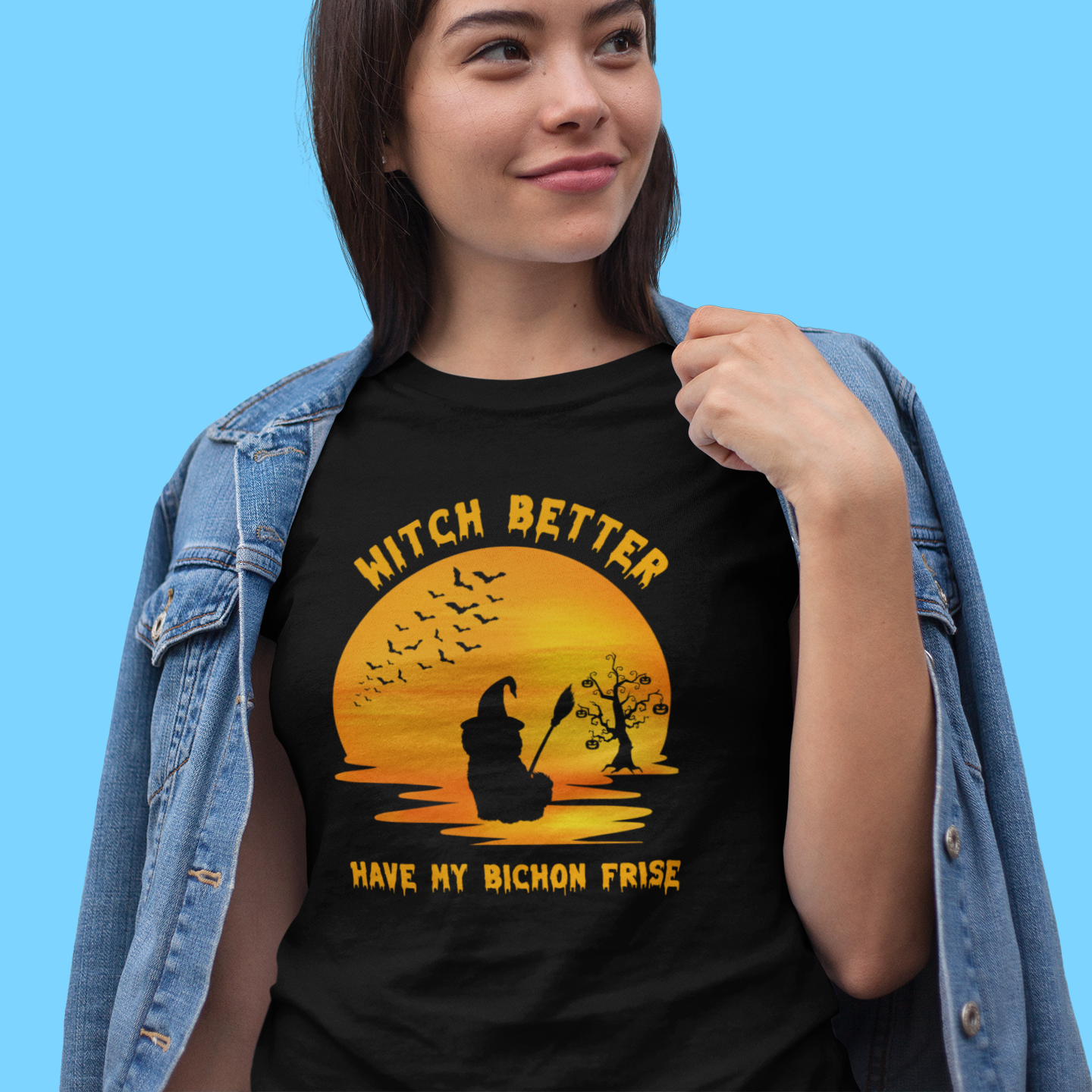 Halloween-themed video of a woman dressed as a witch holding a black cat and wearing a funny “Witch Better Have My Bichon Frise” t-shirt – spooky and playful scene for dog lovers and Halloween fans.