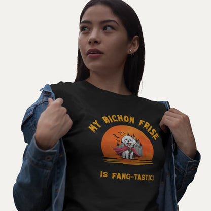 Woman wearing a black t-shirt with a dog graphic and text.