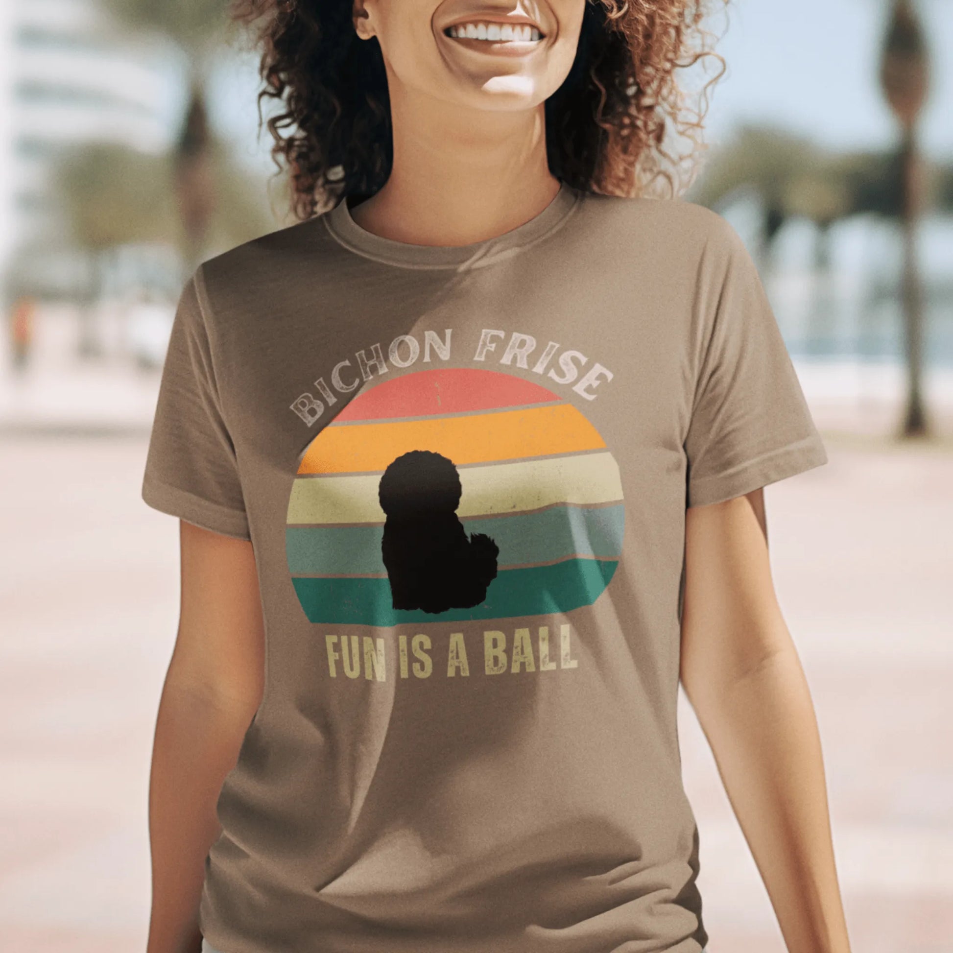 "Colorful unisex t-shirt with playful 'Bichon Frise Fun Is A Ball' text and graphic design, perfect for proud Bichon Frise dog owners – funny and stylish pet lover apparel."