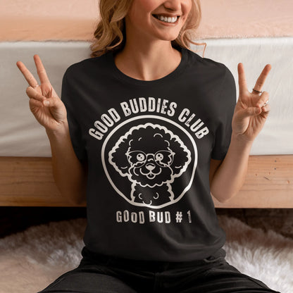 “Good Buddies Club unisex T-shirt featuring a cheerful, smiling Bichon Frise dog wearing glasses illustration with white design. Fun and happy dog-themed shirt for men and women, perfect for dog owners and dog lovers beyond just Bichon Frise fans.”