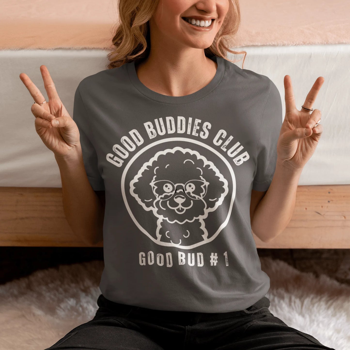 “Good Buddies Club unisex T-shirt featuring a cheerful, smiling Bichon Frise dog wearing glasses illustration with white design. Fun and happy dog-themed shirt for men and women, perfect for dog owners and dog lovers beyond just Bichon Frise fans.”