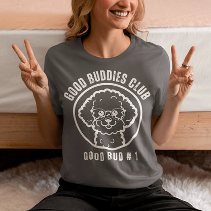 “Good Buddies Club unisex T-shirt featuring a cheerful, smiling Bichon Frise dog wearing glasses illustration with white design. Fun and happy dog-themed shirt for men and women, perfect for dog owners and dog lovers beyond just Bichon Frise fans.”