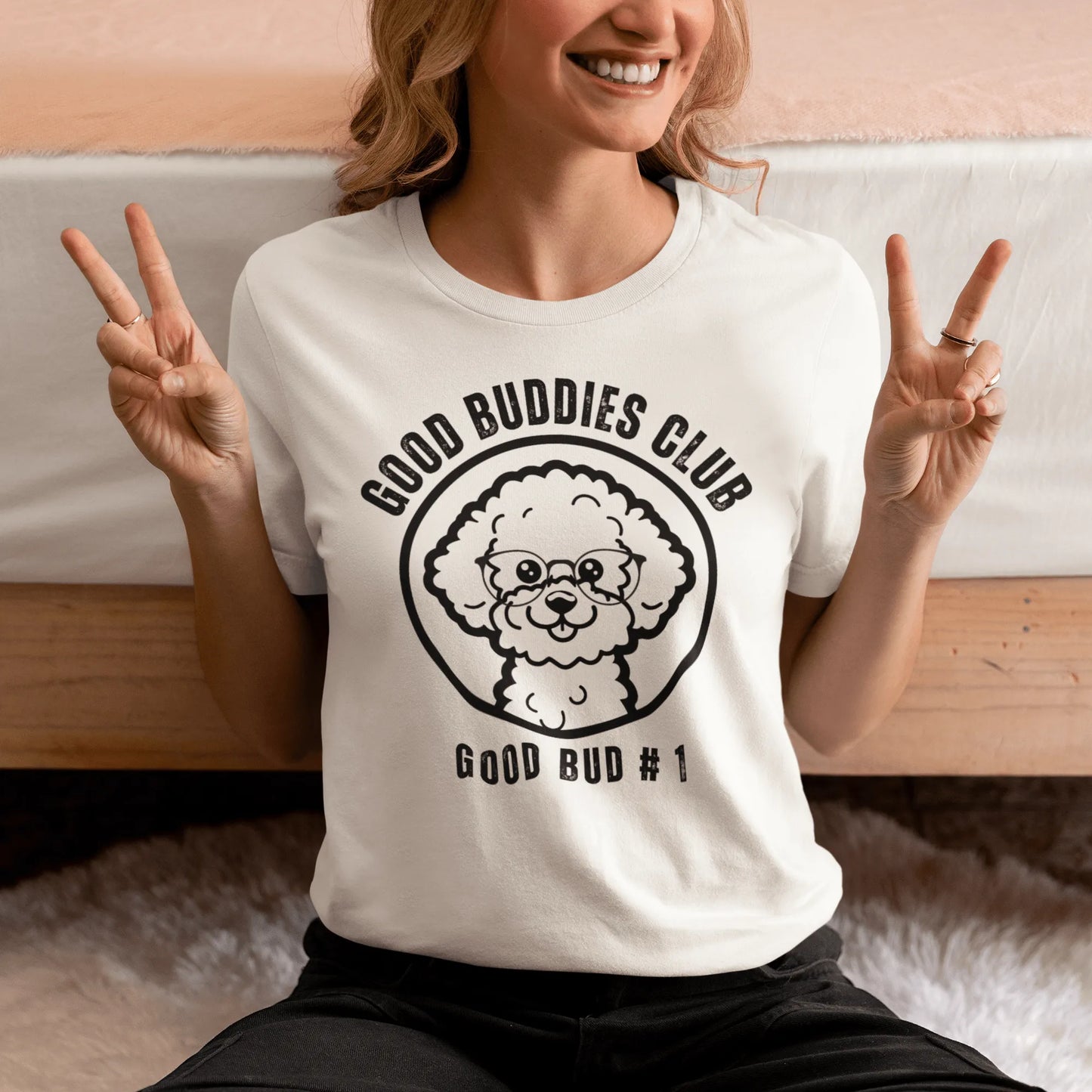 "Good Buddies Club unisex black T-shirt featuring a cheerful, happy Bichon Frise dog illustration wearing glasses, perfect for dog owners and dog lovers. Fun and unique dog-themed shirt design, ideal not only for Bichon Frise fans but all dog enthusiasts."