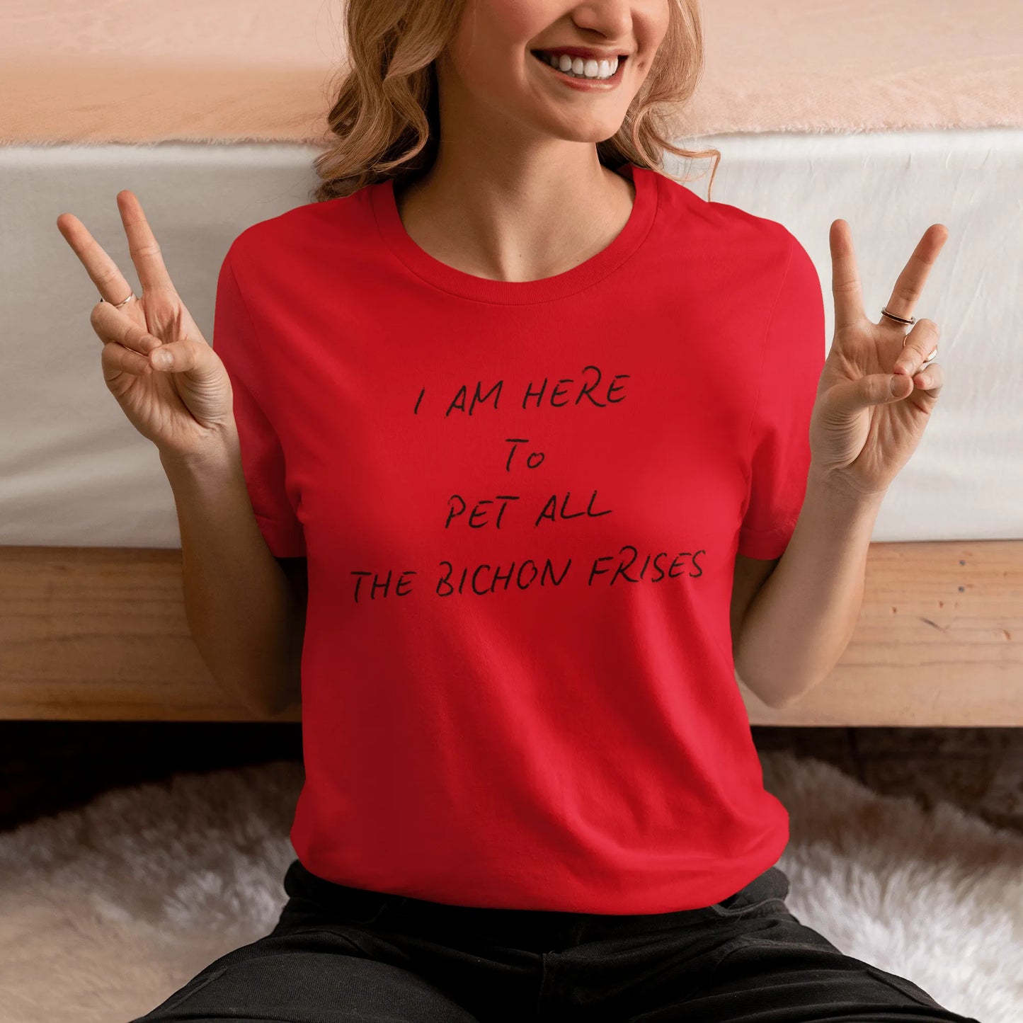 Black unisex t-shirt with the funny quote "I Am Here To Pet All The Bichon Frises" – perfect gift for Bichon Frise dog lovers, minimalist design with playful vibe.