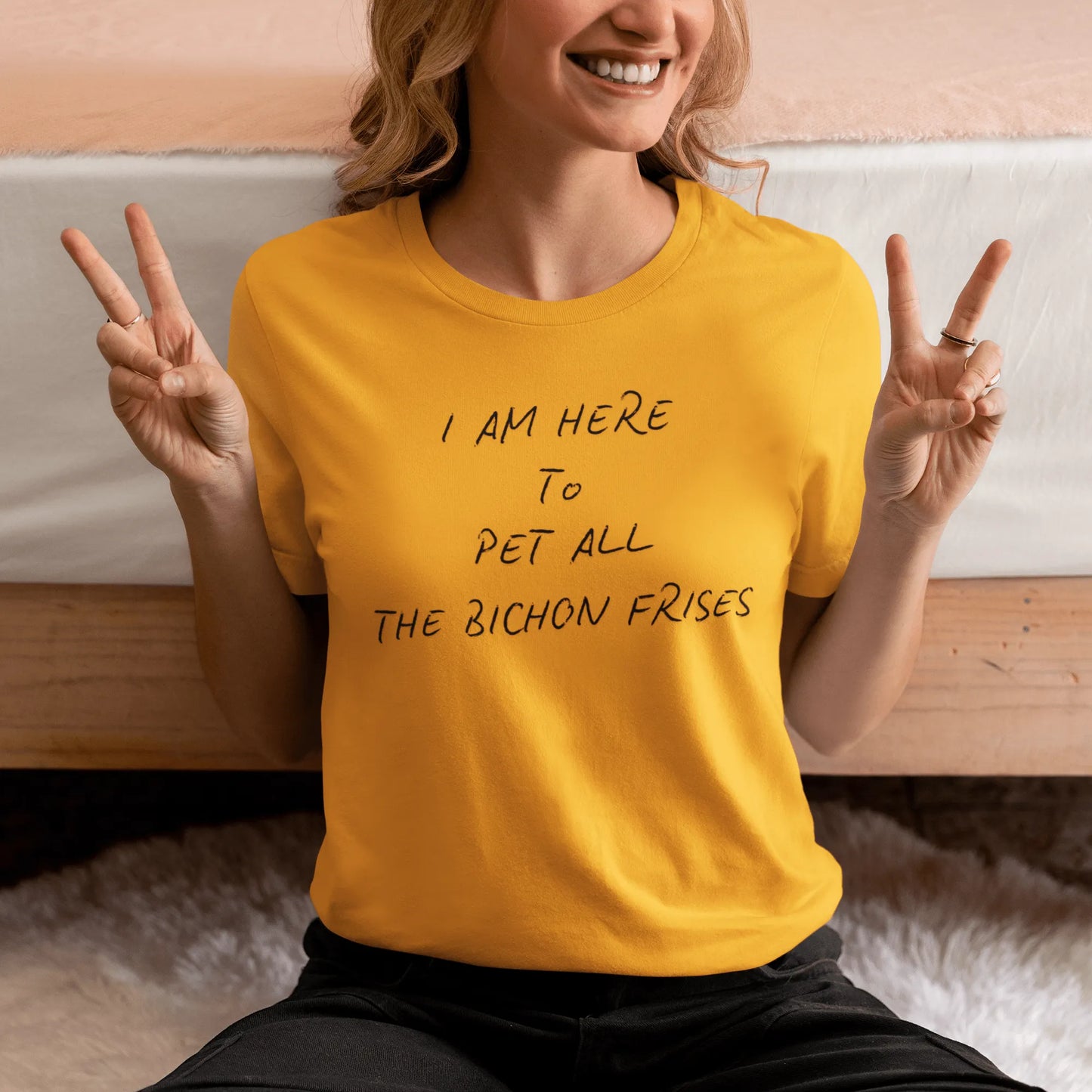 Black unisex t-shirt with the funny quote "I Am Here To Pet All The Bichon Frises" – perfect gift for Bichon Frise dog lovers, minimalist design with playful vibe.